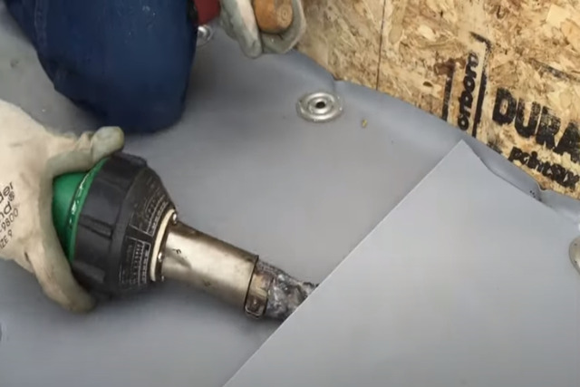 Worker installing insulation plates